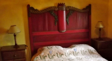 The Casa sleeps 4 in two double-bedded rooms – here a polychrome bed and cupboard with a carved Indian window frame.